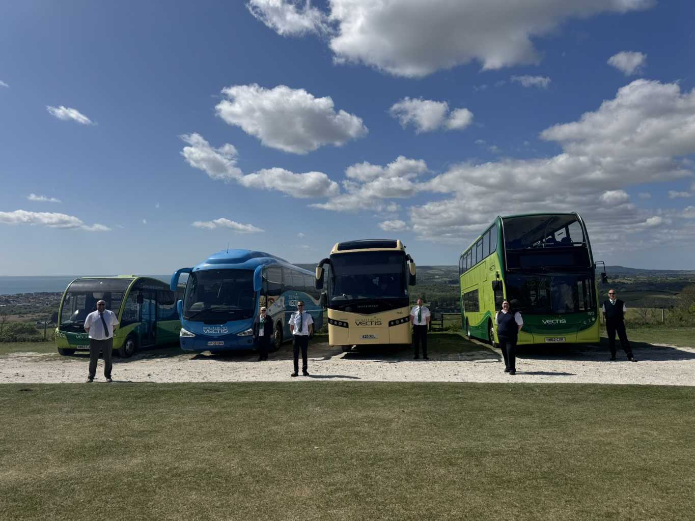 buses lined up with drivers in front