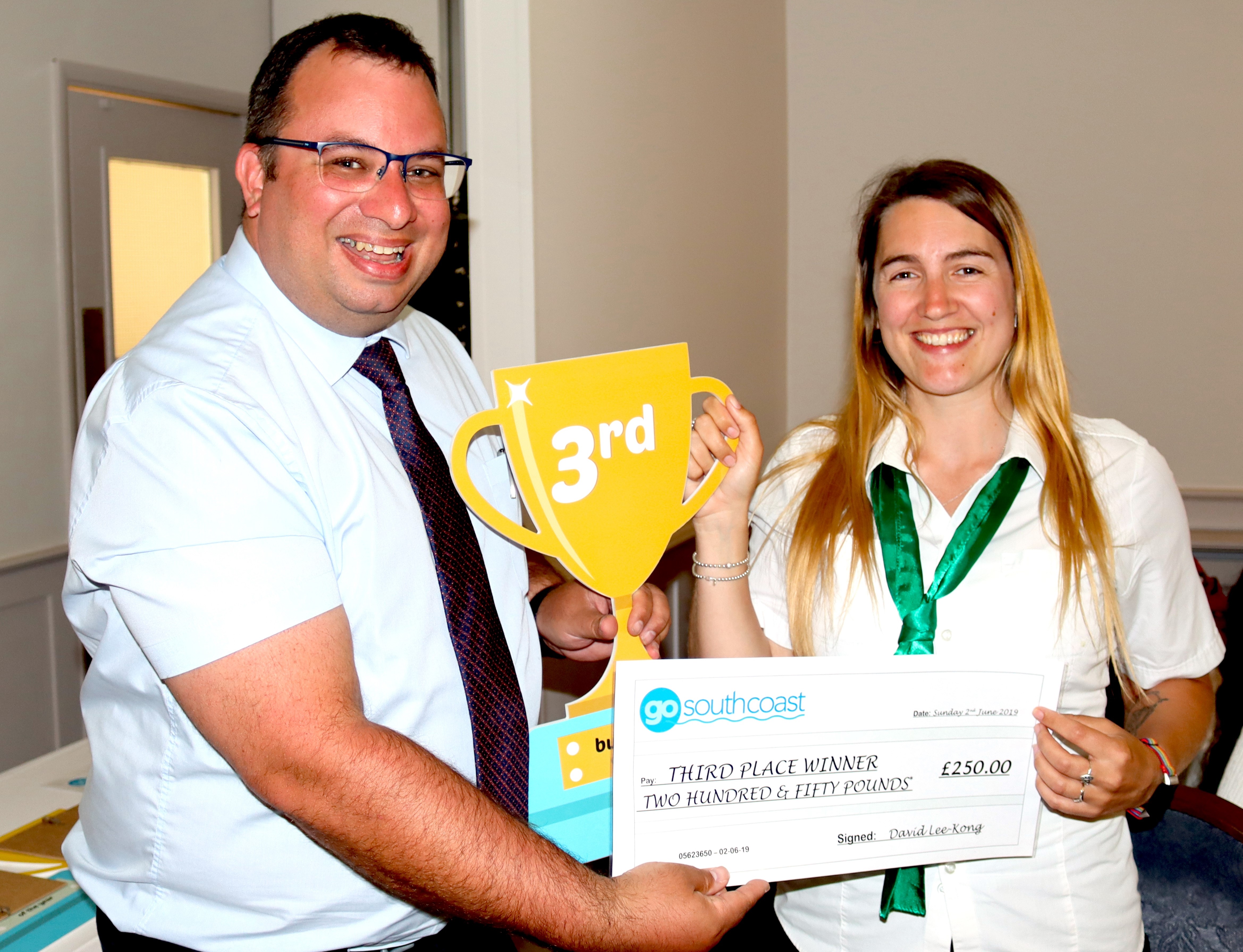 Cheque presentation to a driver with a 3rd place cup