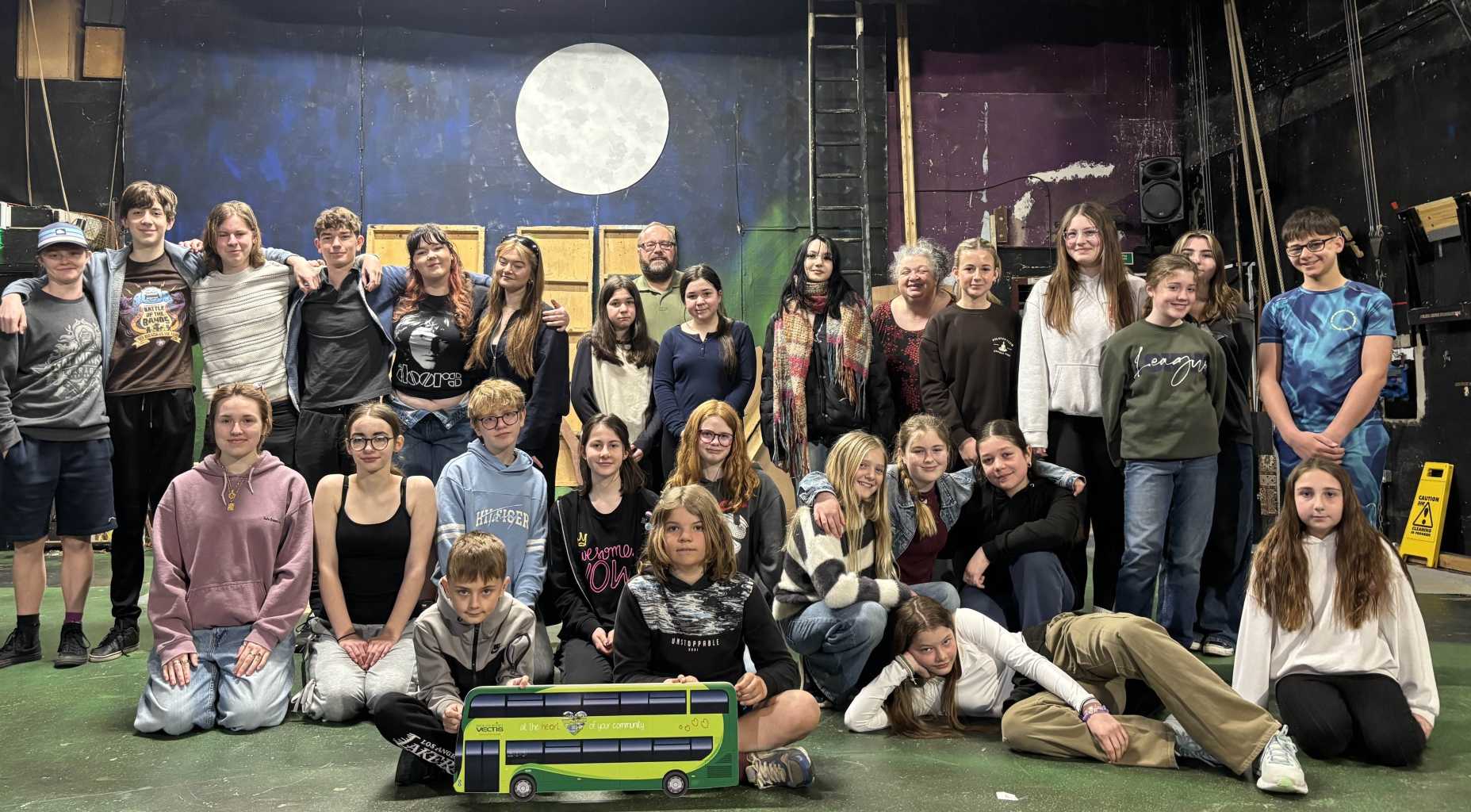 group of young people on theatre stage