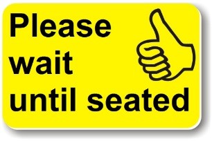 Please wait until seated - yellow card with a thumbs up